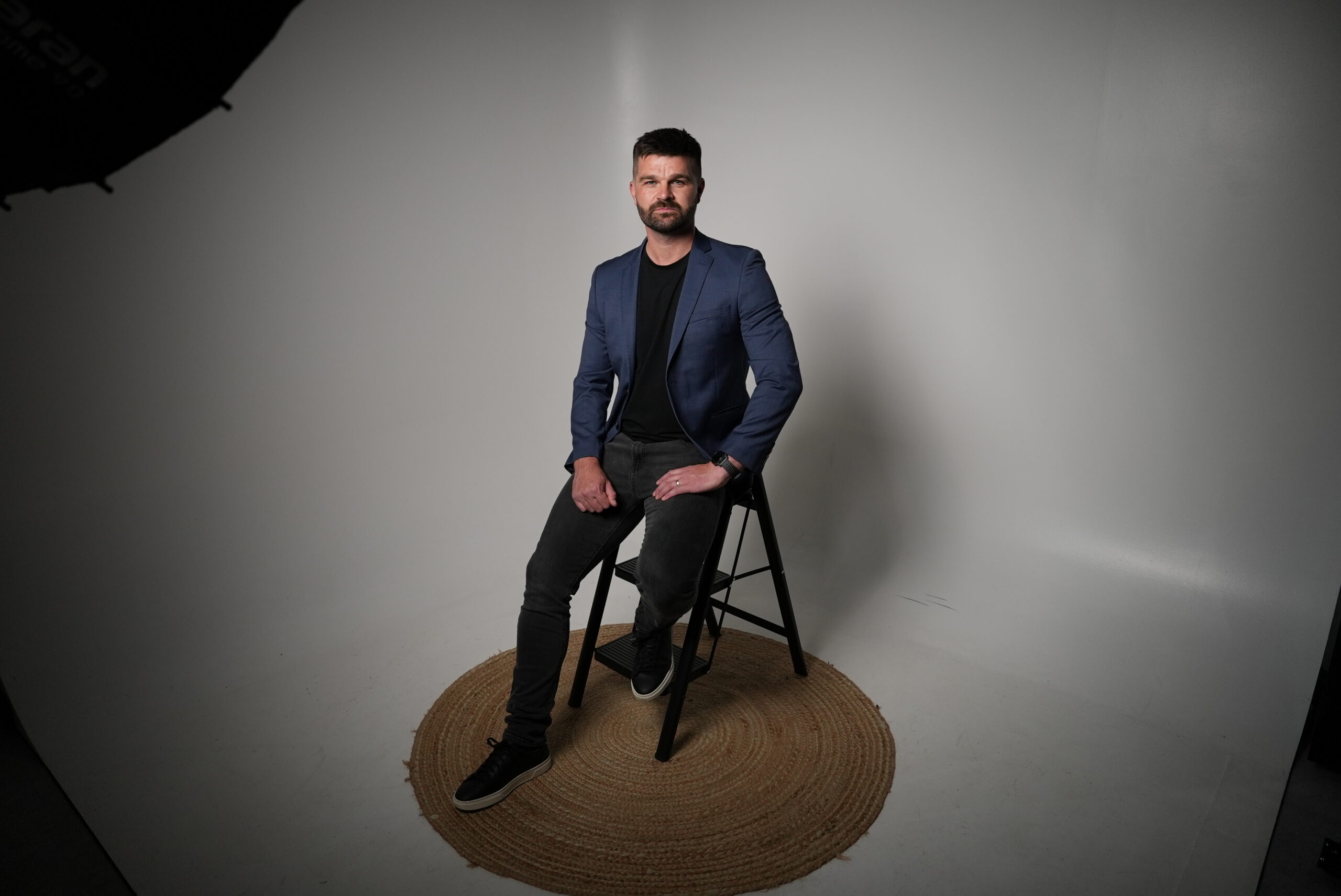 Joe Sharp, owner of Sharp Physiotherapy, relaxed and confident